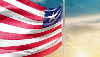 Waving flag of Liberia in beautiful sky. Flag for independence day - Image