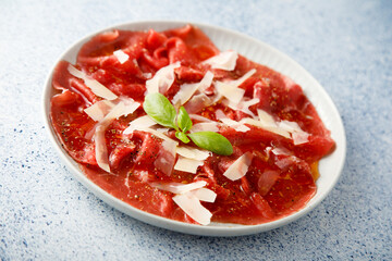 Traditional beef carpaccio with parmesan cheese