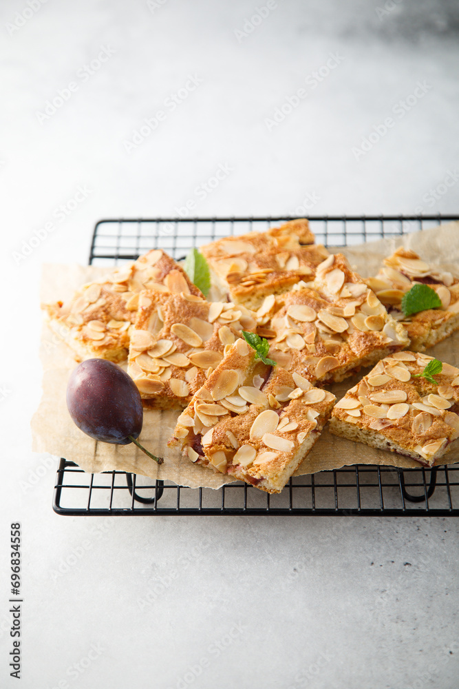 Sticker homemade plum pie with almond flakes