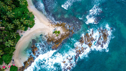 Beautiful Indian Ocean coastline on the island of Sri Lanka, Mirissa. Aerial photography.