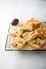 Homemade plum pie with almond flakes