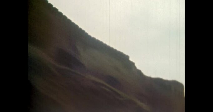 Defensive wall panorama of medieval castle in spring. High impregnable wall of fort outdoors. historic Fortress architecture. Ancient Europe landmark. Vintage footage of archival film. 1980s archive