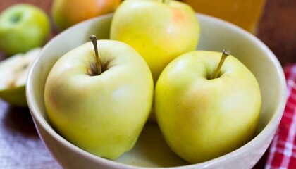 Apple in the white bowl