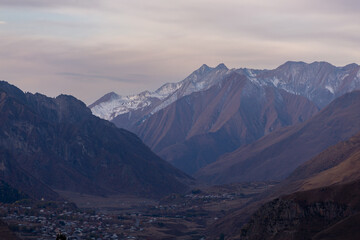 Fototapeta premium Caucasus mountains at sunset, dramatic landscape
