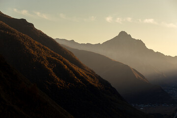 autumn mountains at sunset haze