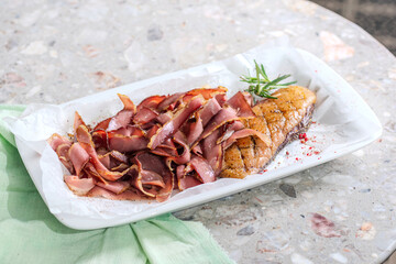 Plate of appetizing duck jamon served