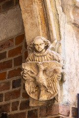Church of St. Barbara, a bracket with an angel holding the coat of arms of the Kingdom of Poland,...