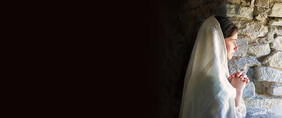 Young girl at old window