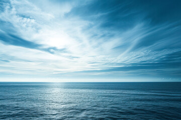 Obraz premium Coastal serenity, open sky landscape with the vastness of the ocean meeting the horizon, a peaceful and calming scene with abundant copy space, perfect for various design applications.