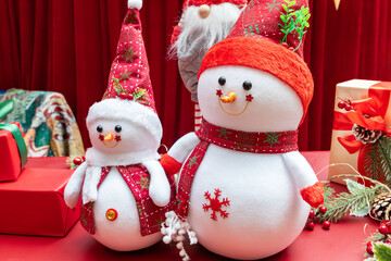 cute Christmas snowmen and Santa Claus at horizontal composition