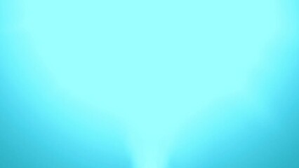 Glittering particles with lens flare on a black background in slow motion, dynamic wind particles in the air with bokeh.