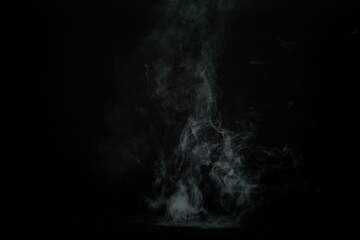 Abstract smoke misty fog on isolated black background. Texture overlays. Design element.