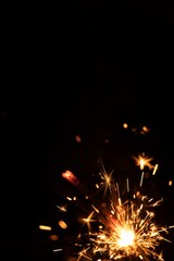 Obraz premium Perfect fire particles embers sparks on black background . Texture overlays.