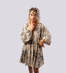 Portrait of a happy young woman dancing isolated on a white background with a tiara on her head...