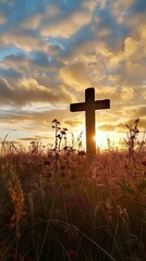 Silhouette of a cross on the background of a bright sunset