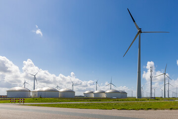 Storage of fuels and wind turbines in Eemshaven seaport in the north-east of province Groningen in The Netherlands - obrazy, fototapety, plakaty