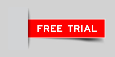 Red color square label sticker with word free trial that inserted in gray background