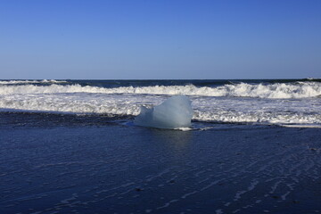 View on a iceberg on the Diamond Beach located south of the Vatnaj&ouml;kull glacier between the Vatnaj&ouml;kull National Park and the town of H&ouml;fn
