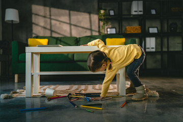 Toddler girl caucasian child play with crayons at home