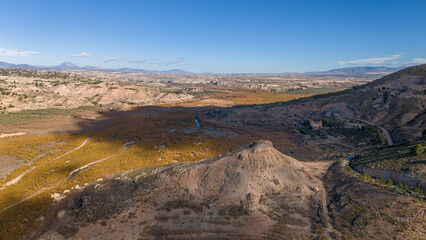 Aerial drone view of the lake Negratin in Spain with the hot springs.