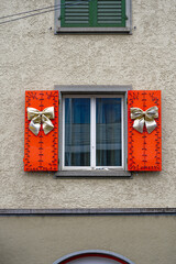 Fototapeta na wymiar Beautiful Christmas decoration on shutters of window at Swiss City of Zürich on a winter day. Photo taken December 22nd, 2023, Zurich, Switzerland.