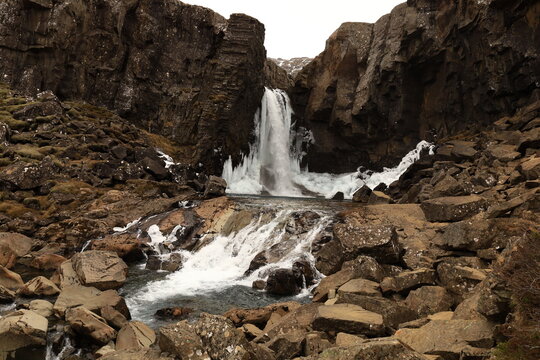 Nykurhylsfoss is a hidden waterfall on the Fossá River in the Fossárdalur region