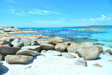 FIRE-COLORED ROCKS OF TASMANIA.