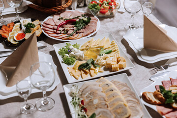 Top view of a beautifully decorated table with delicious food. Everything is ready for lunch or...