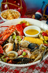 An assortment of fresh mussels, clams, steamers, lobster, shrimp and corn on the cob