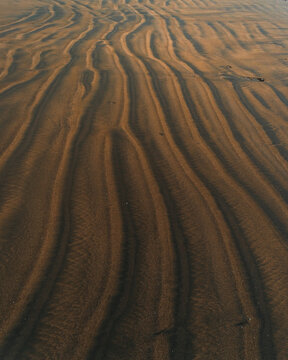 Beautiful texture of the sand on the beach