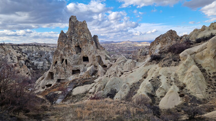 Within Cappadocia's Open-Air Museum: A labyrinth of caves carved into the soft tuff, each echoing...