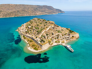 Aerial drone view of an old Venetian fortress island and former Leper colony. Spinalonga, Crete,...