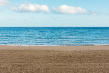 Fototapeta na wymiar Beautiful sandy beach on sea background. Summer concept.