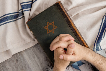 Hands and Old Book Talmud. Hebrew Rabbinic Judaism, Jewish religious law. Torah, Hebrew Bible. Star...