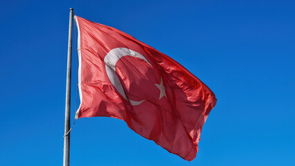 Fluttering proudly: The Turkish flag dances gracefully in the wind.