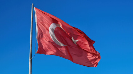 A closeup reveals the intricate details of the Turkish flag, symbolizing unity, heritage, and national pride.