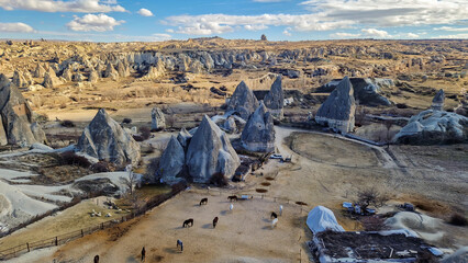 Set against Cappadocia's captivating panorama, a horse ranch emerges as a serene oasis, where noble...