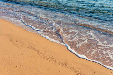 Wave of the sea on the sand beach