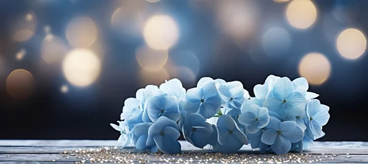 Keuken spatwand met foto Blue hydrangea on isolated magical bokeh background with copy space for text placement © Ilja