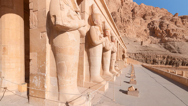 Hatshepsut Temple at sunrise in Valley of the Kings and red cliffs western bank of Nile river - Luxor- Egypt