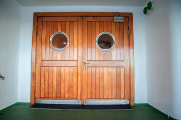 Doors for access to the open deck of the passenger ship. Large massive doors on the deck of a...