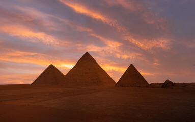 Fototapeta na wymiar Giza Pyramid Complex at amazing sunset - Cairo, Egypt