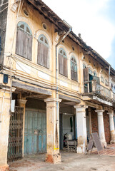 Fototapeta na wymiar Old French colonial building along the Sangker river in Battambang, Cambodia, Asia