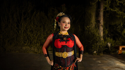an Indonesian dancer radiates charm that attracts the attention of the audience throughout the...