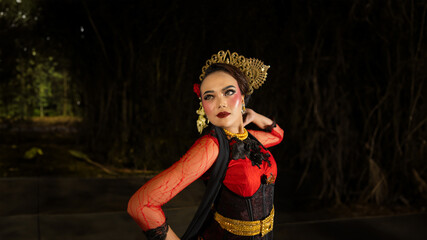 an Indonesian dancer shows a dance that shows the beauty of a tradition full of stories in every...