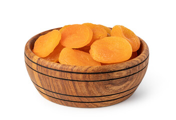 dried apricots in a wooden bowl