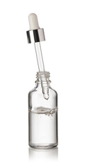 Drop falls from a pipette into a cosmetic bottle