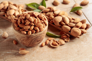Almond nuts in a wooden bowl.