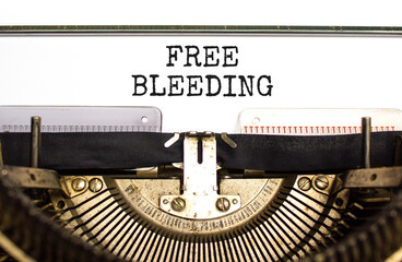 Free bleeding symbol. Concept words Free bleeding typed on beautiful old retro typewriter....