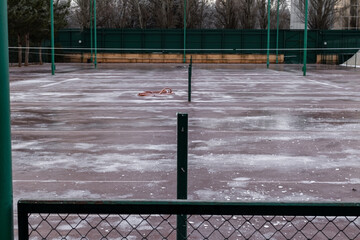 Ice covered tennis court in winter